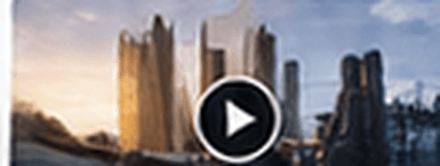 Golden-lit city skyline at dusk with a video play control