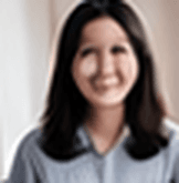 Smiling woman practicing an AI mock interview